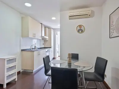 a kitchen and dining room with a table and chairs at Citytrip Poble Nou Beach in Barcelona