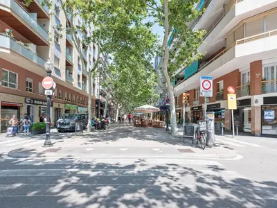 a street in a city with buildings and trees at Citytrip Poble Nou Beach in Barcelona