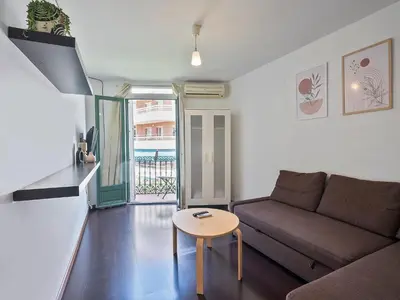 a living room with a couch and a table at Citytrip Poble Nou Beach in Barcelona
