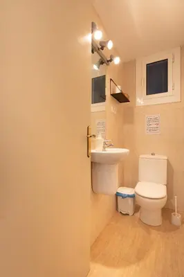 a bathroom with a toilet and a sink at bp1- Piso para Grandes Grupos in Barcelona