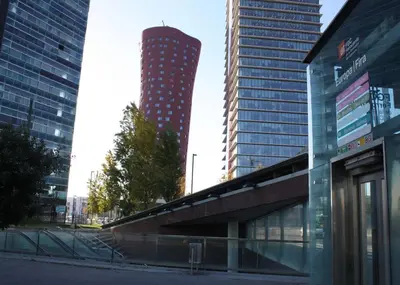 a tall building in the middle of a city at ApartsNouBcn Fira Barcelona in Hospitalet de Llobregat