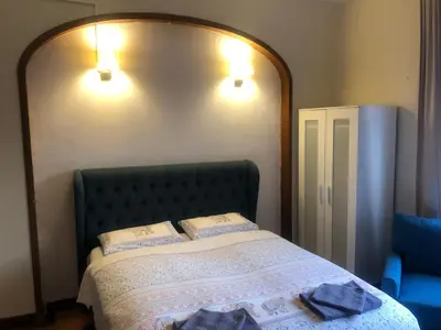 a bedroom with a bed with two pillows on it at Casa les Pomeretes in El Figaró