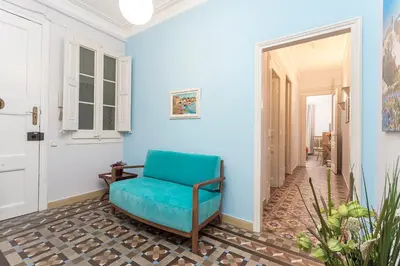 a blue room with a blue chair in a hallway at Luxury & Elegant Apartment in the centre in Barcelona