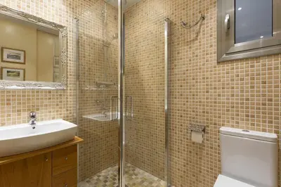 a bathroom with a glass shower and a sink at Beautiful & Luxury Apartment centrally-located in Barcelona