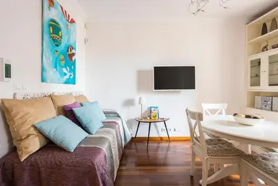 a living room with a couch and a table at Beautiful & Luxury Apartment centrally-located in Barcelona