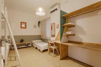 a hospital room with a bed and a table at Bird House in Barcelona