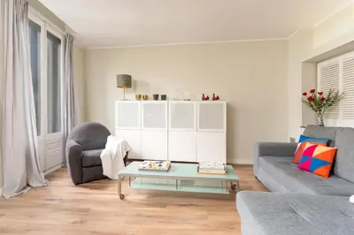 a living room with a couch and a coffee table at SibsBcn COLISEUM - Cozy and Central in Barcelona