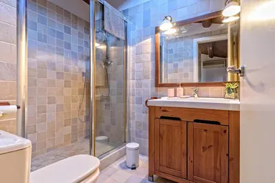 a bathroom with a toilet sink and a shower at Apartamento con encanto en Badalona in Badalona