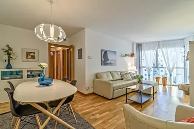 a living room with a table and a couch at Apartamento&piscina cerca de Barcelona in Ripollet
