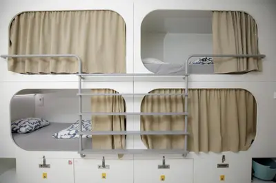 a room with two bunk beds and a window at Onefam Ramblas in Barcelona
