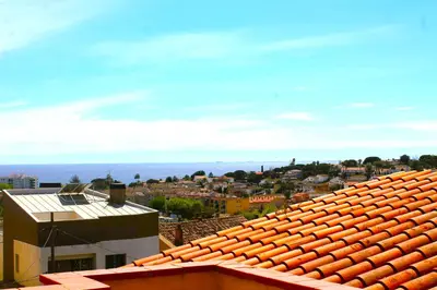 a view of a city from the roof of a building at House with Pool and Sea Views in Alella