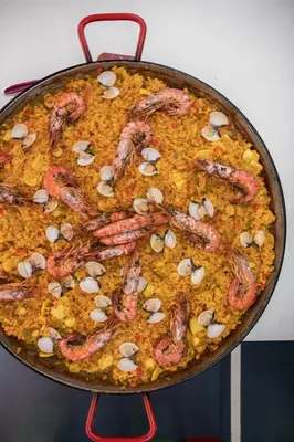 a pan full of food with shrimp on it at Sant Jordi Hostels Gracia in Barcelona