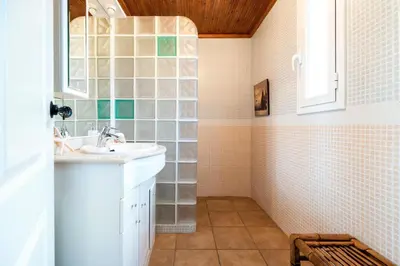 a bathroom with a sink and a mirror at Casa Xixella a 15 min de Sitges in Olivella