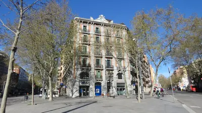 a large building with trees in front of it at Stay Together Barcelona Apartments in Barcelona
