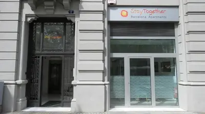 an entrance to a building with a sign on it at Stay Together Barcelona Apartments in Barcelona