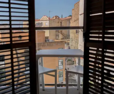 a view of a balcony from a window at Dynamic Hotels Caldetes Barcelona in Caldes d'Estrac