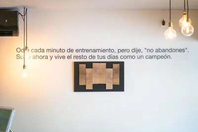 a picture of a wall with a sign that reads oh each minute die entertainment at Dynamic Hotels Caldetes Barcelona in Caldes d'Estrac