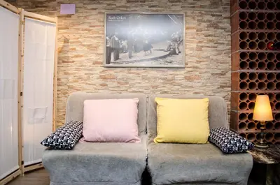 two pillows sitting on a couch in a room at Loft Vacarisses Torreblanca Estación, Piscina Privada in Vacarisas