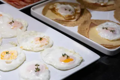 a bunch of eggs on plates on a table at Hotel Ciutadella Barcelona in Barcelona