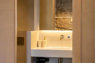 a bathroom with a sink and a mirror at Decô Apartments Barcelona-Born St. in Barcelona