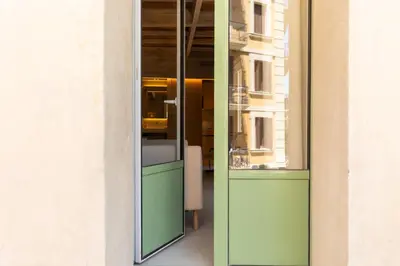 a glass door to a window in a building at Decô Apartments Barcelona-Born St. in Barcelona