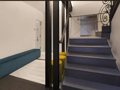 a hallway with blue stairs in a building at Decô Apartments Barcelona-Born Apt. in Barcelona