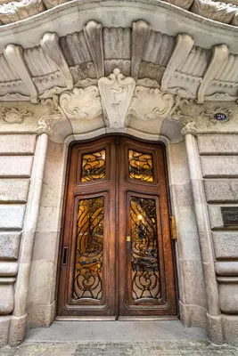 a pair of wooden doors on a building at Luxury Penthouses 1 in Barcelona