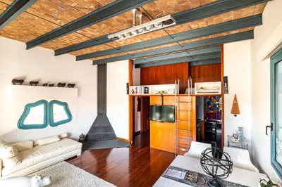 a living room with a couch and a stove at Luxury Penthouses 2 in Barcelona