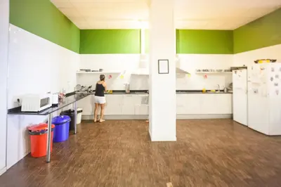 a living room with a couch and a table at 360 Hostel Centro in Barcelona