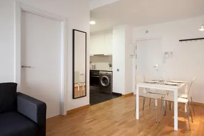 a living room with a white table and a couch at AB Gracia Sant Salvador in Barcelona