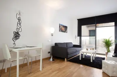 a living room with a couch and a table at AB Gracia Sant Salvador in Barcelona