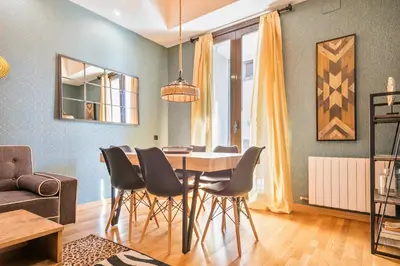 a dining room with a table and chairs at Midtown Luxury Apartments by Sweett in Barcelona