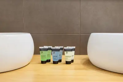a group of four products sitting on a table at Art House Granvia in Barcelona