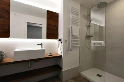 a bathroom with a sink and a shower at ClassBedroom Port Ramblas in Barcelona