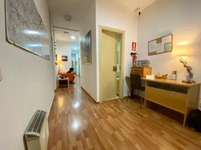 a hallway with a desk and a desk at Barcelona Housing recommend for Students in Barcelona