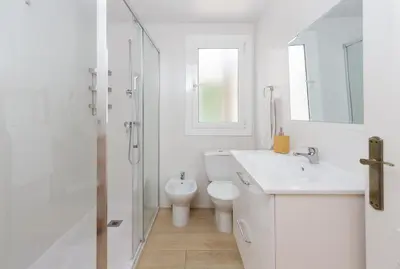 a bathroom with a toilet and a sink and a shower at Casa Cosi - Mallorca 3 in Barcelona
