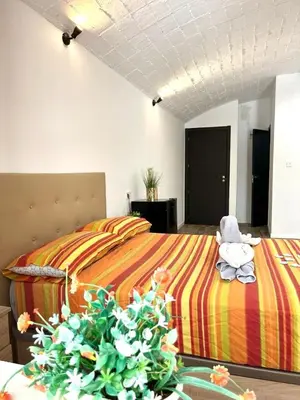 a bedroom with two beds and a stuffed animal sitting on the bed at Barceló Apartaments in Monistrol