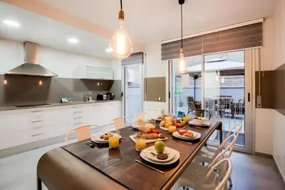 a kitchen with a wooden table with fruit on it at Sweett - Callao Plaza in Barcelona