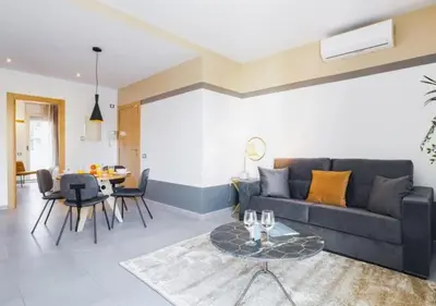 a living room with a couch and a table at Sweett - Callao Plaza in Barcelona