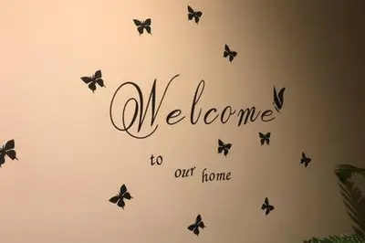 a welcome to our home wall with butterflies at Camp Nou , Fira Barcelona Apartment in Hospitalet de Llobregat
