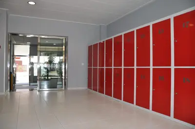a locker room with red lockers in a building at Casablanca Suites - Adults Only in Calella