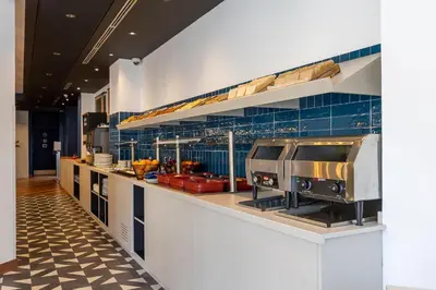 a kitchen with a counter with some food at Travelodge Barcelona Poblenou in Barcelona