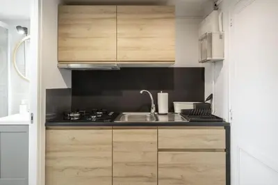 a kitchen with a sink and a stove at NEW Renovated COZY APPARTMENT CENTRIC in Barcelona