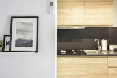 a kitchen with a sink and a picture on the wall at NEW Renovated COZY APPARTMENT CENTRIC in Barcelona