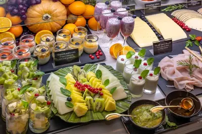 a buffet filled with cheese and fruits and other foods at SERHS Carlit Boutique Hotel in Barcelona