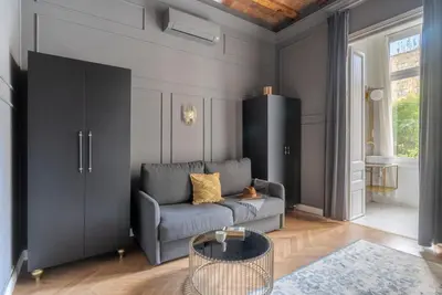 a living room with a couch and a table at TSA Gran Via in Barcelona