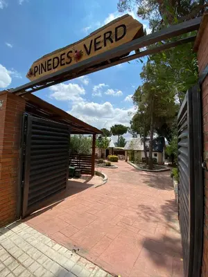 a garage door with a sign on top of it at Pinedes Verd in La Torre de Claramunt