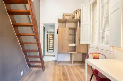 a small kitchen with a staircase leading to a room at Aqua Apartment by Olala Homes in Barcelona