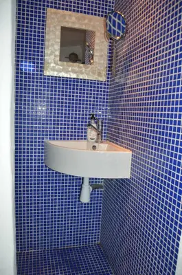 a bathroom with a sink and a blue tiled wall at Entre Olivos: Very Charming Villa 18 SLEEPERS in Sant Pere de Ribes
