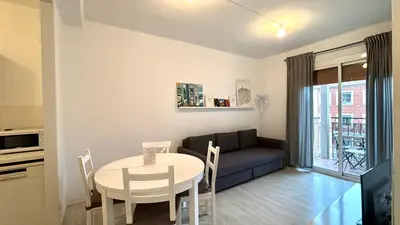 a living room with a table and a couch at Sagrada Familia - Sant Pau apartment in Barcelona